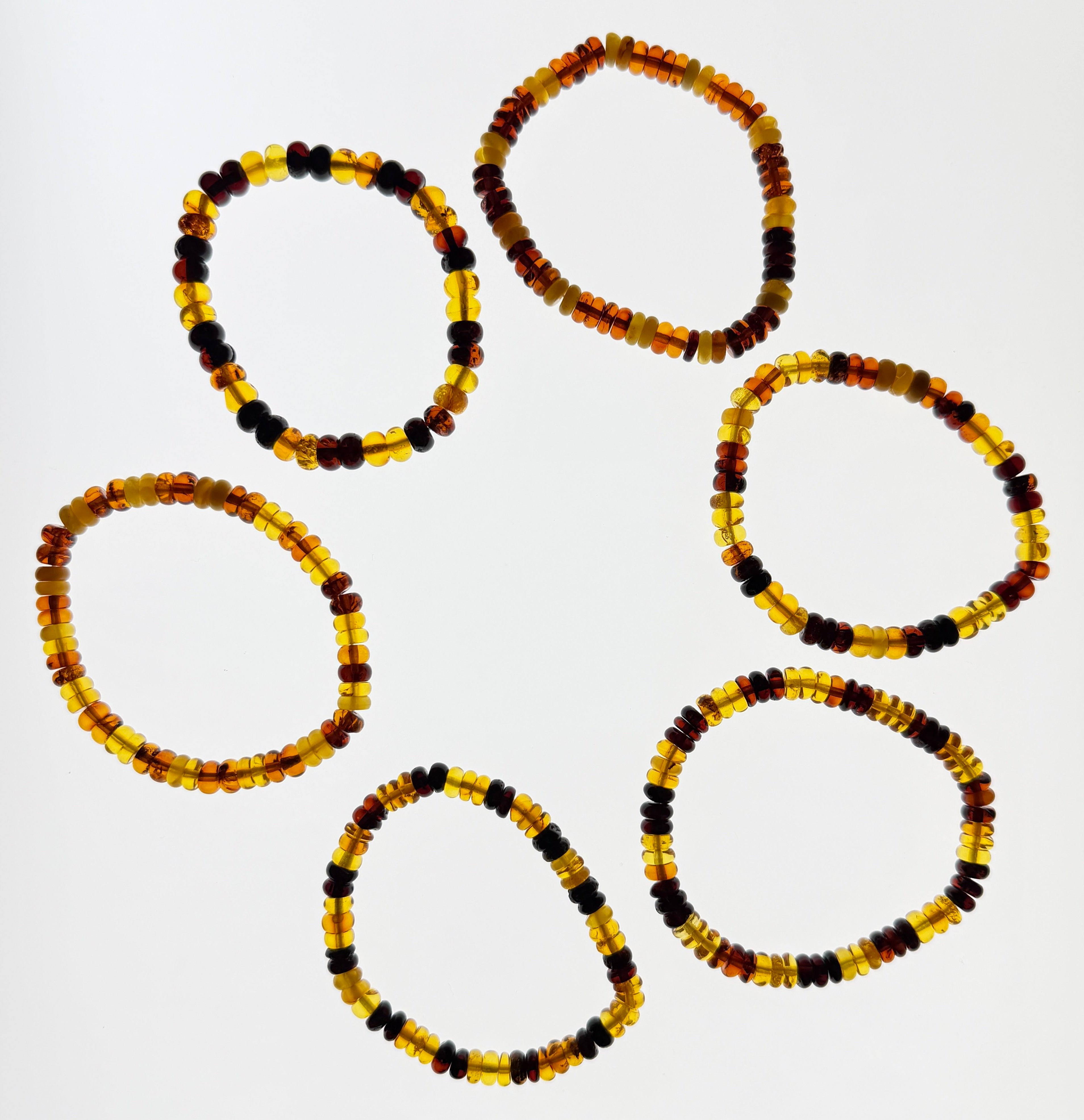 Bernstein (bunt) – Button-Armband 3×6 mm (elastisch, ca. 19 cm)