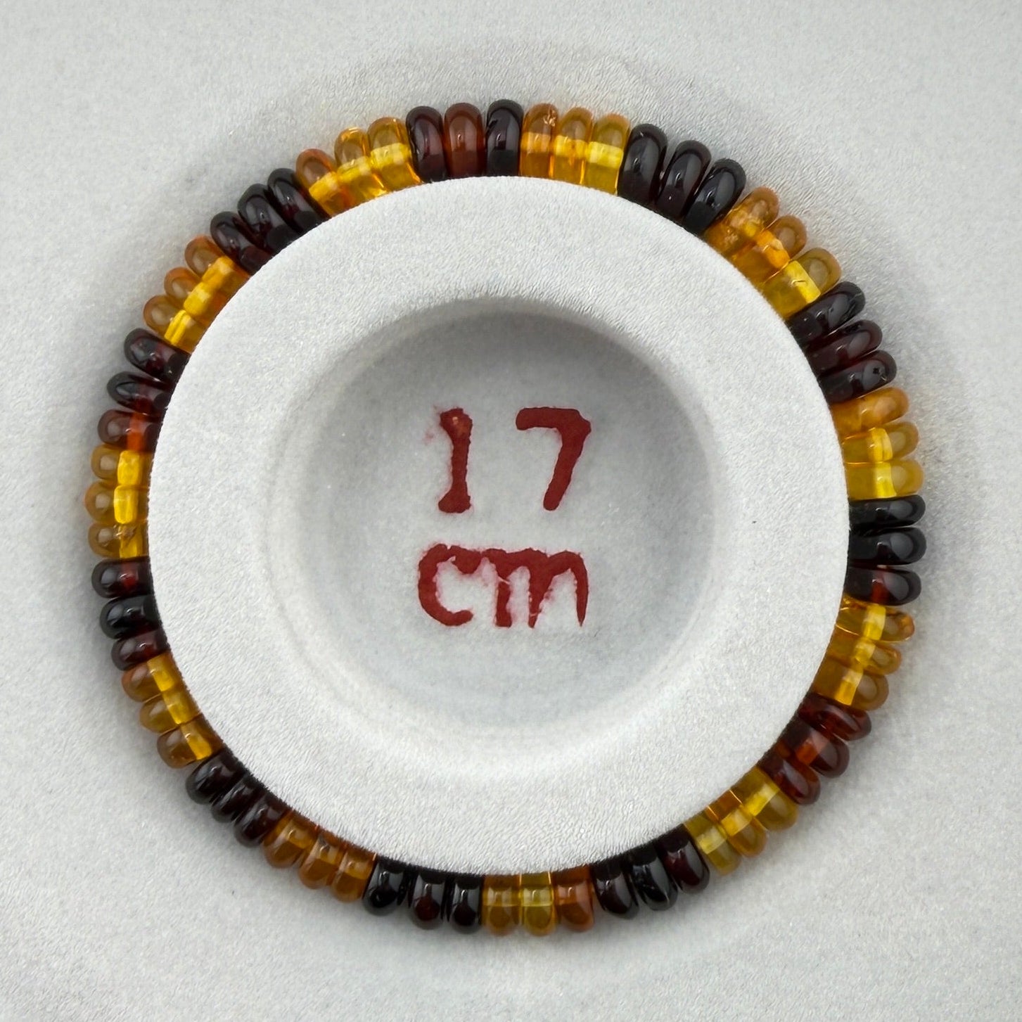 Bernstein (bunt) – Button-Armband 3×6 mm (elastisch, ca. 19 cm)