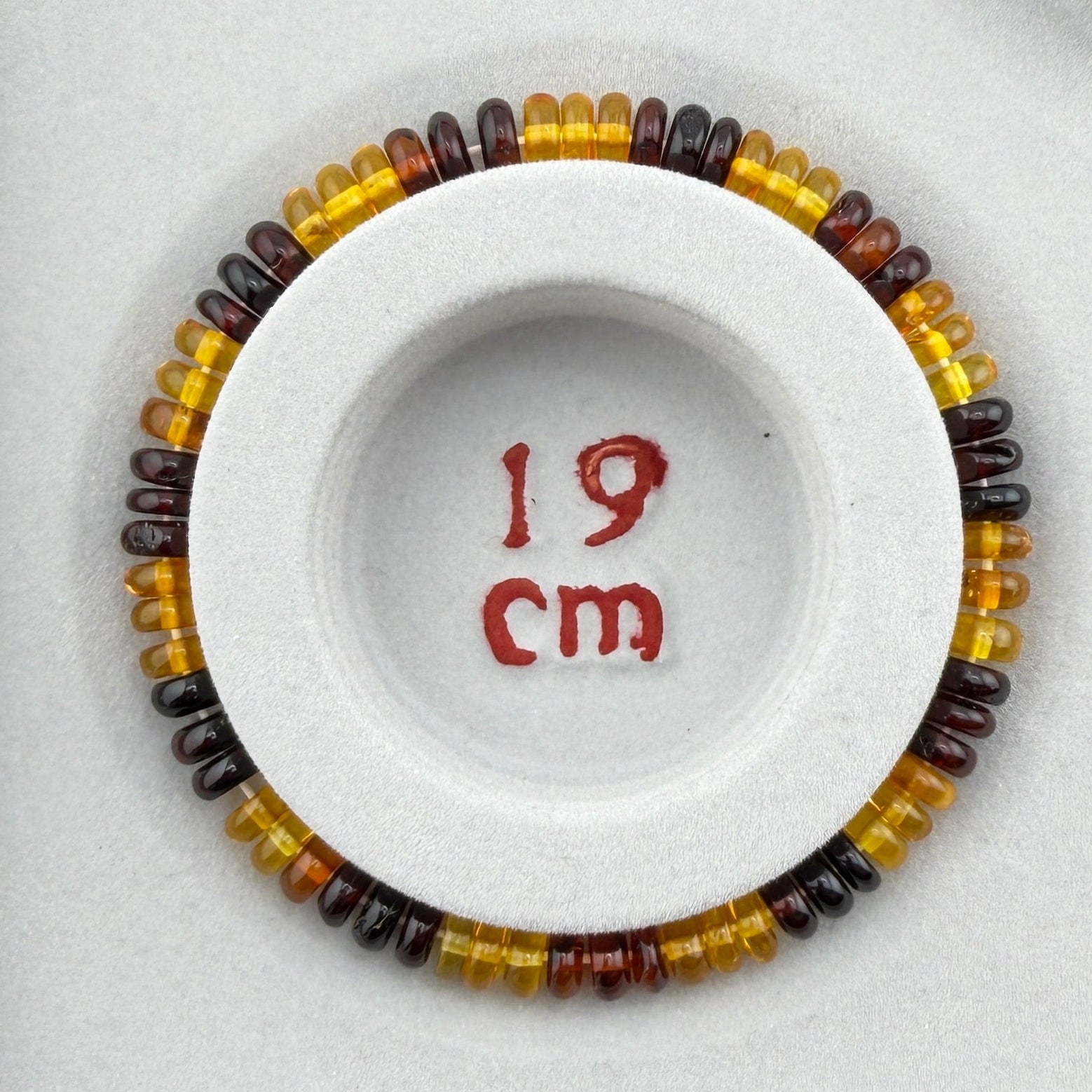 Bernstein (bunt) – Button-Armband 3×6 mm (elastisch, ca. 19 cm)
