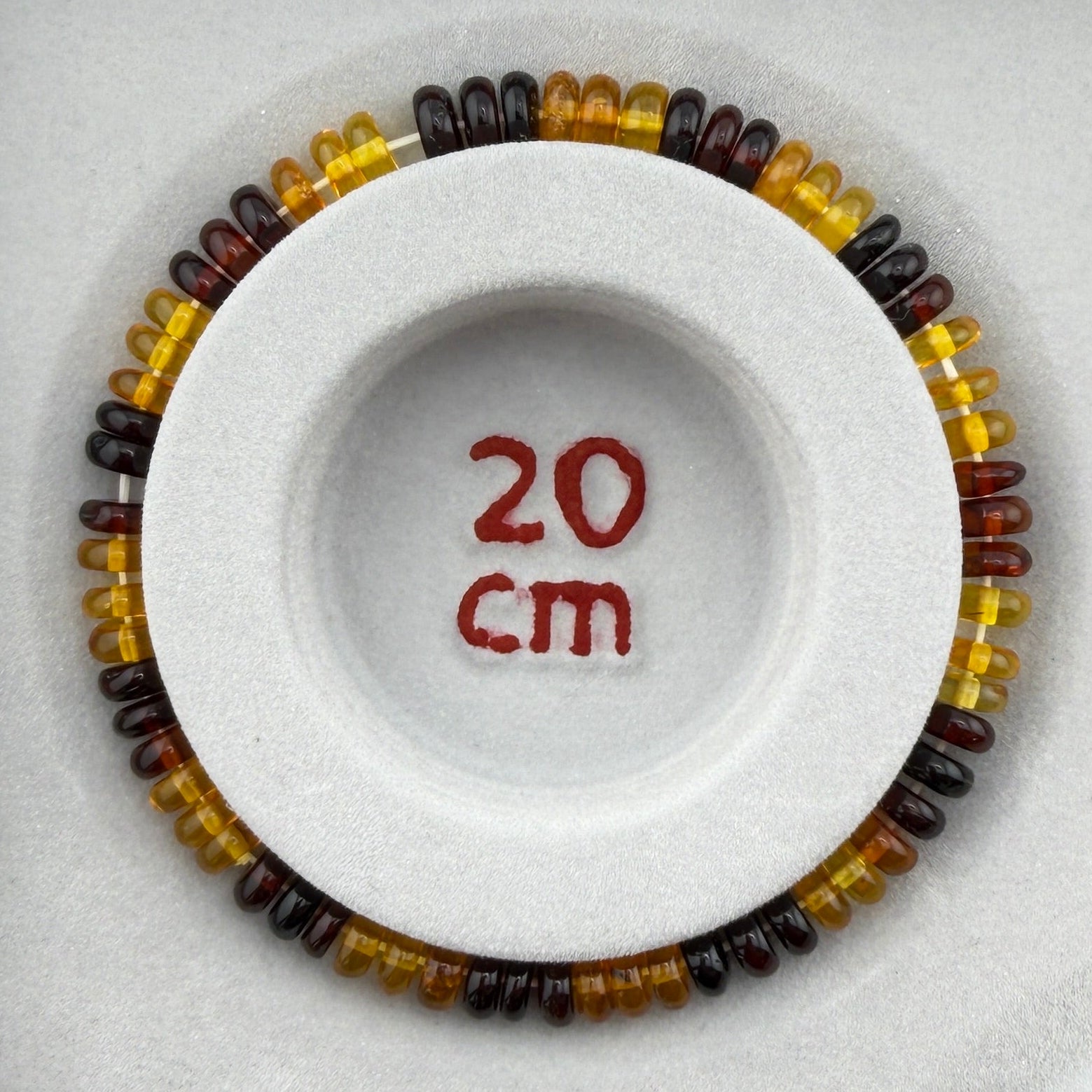 Bernstein (bunt) – Button-Armband 3×6 mm (elastisch, ca. 19 cm)